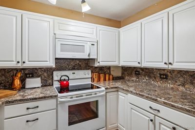 Kitchen feeatures abundance of counter cabinet space | Image 2