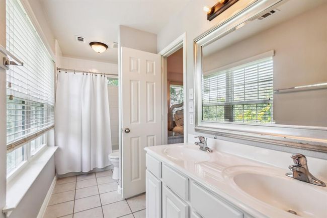 This Jack and Jill bathroom connects between bedroom 3 and 4 | Image 31
