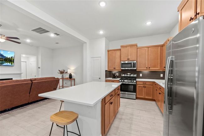 Additional seating at the kitchen island. | Image 11