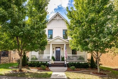 Custom craftsman property on one of the prettiest streets in coveted Tollgate Village. | Image 1