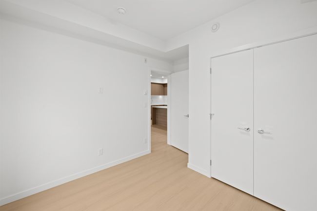 Unfurnished bedroom with light wood-style floors and a closet | Image 16