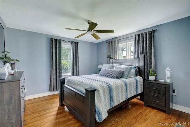 Bedroom featuring light wood-type flooring and ceiling fan | Image 46