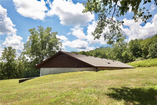 View of side of home featuring a yard | Image 6