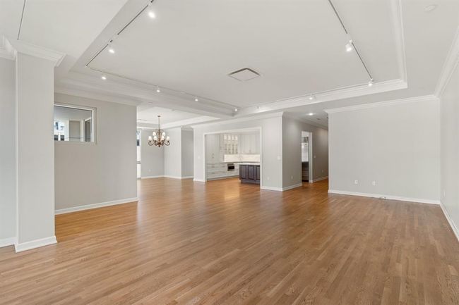 View of the kitchen open to the dining and living room. | Image 21