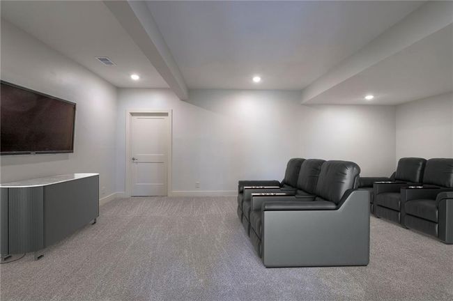 Lower level media room virtually staged. | Image 51