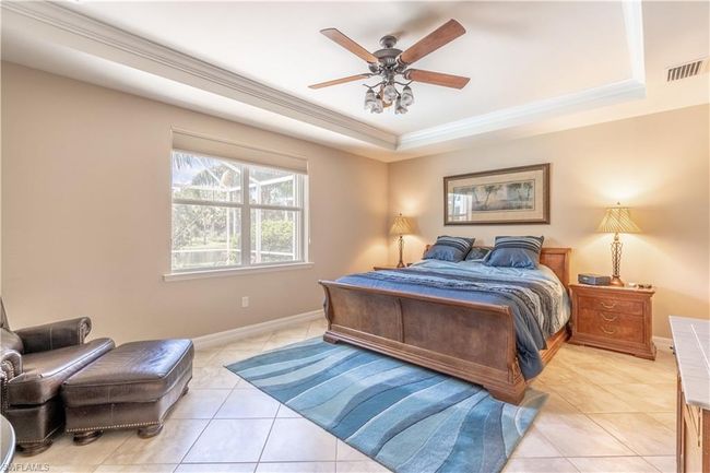 Washroom with washing machine and clothes dryer and light tile patterned floors | Image 31