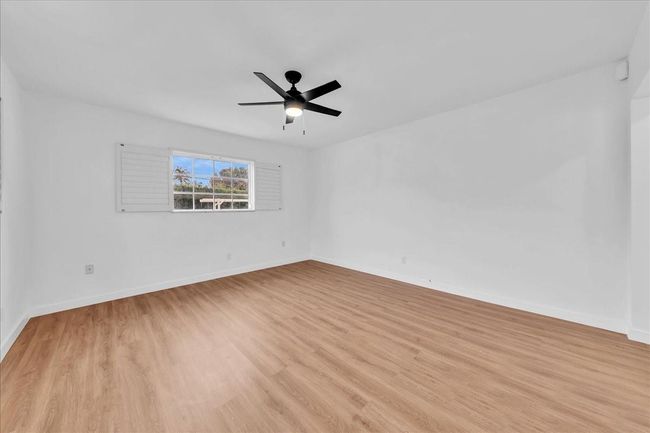 with Walk-in Closet, Plantation Shutters & New Ceiling Fan | Image 24