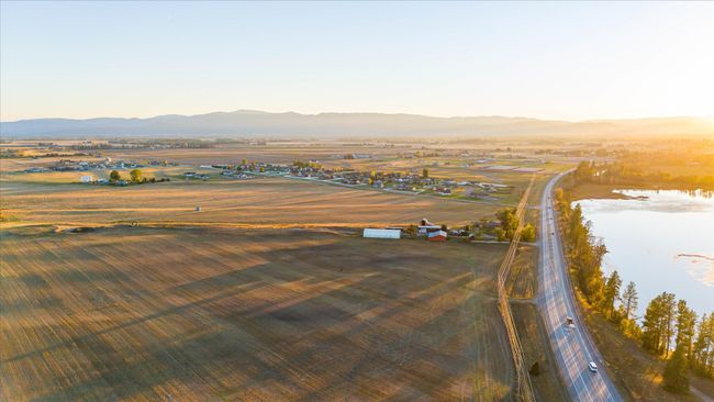 Aerial view at dusk featuring a rural view and a mountain view | Image 72