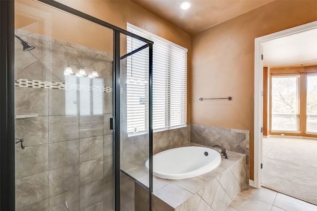 Full bathroom featuring a garden tub, tile patterned floors, and a shower stall | Image 24