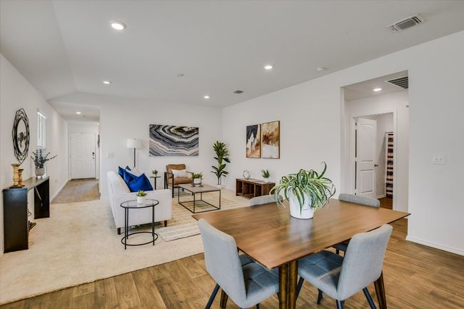 Dining room with recessed lighting, wood finished floors, and visible vents | Image 7