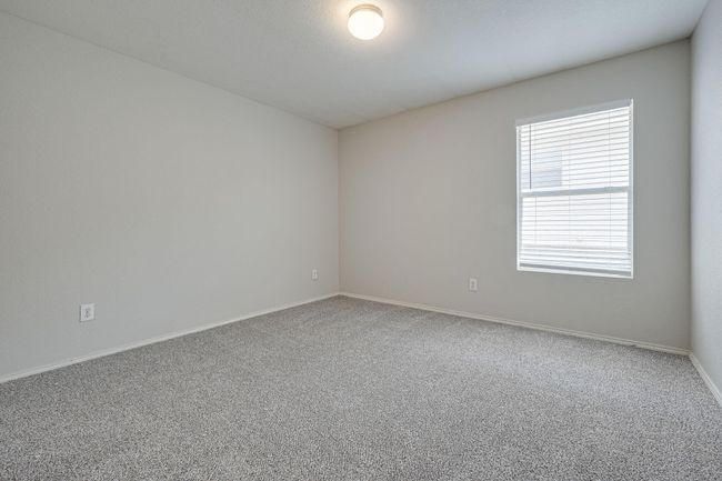 Carpeted empty room featuring baseboards | Image 20