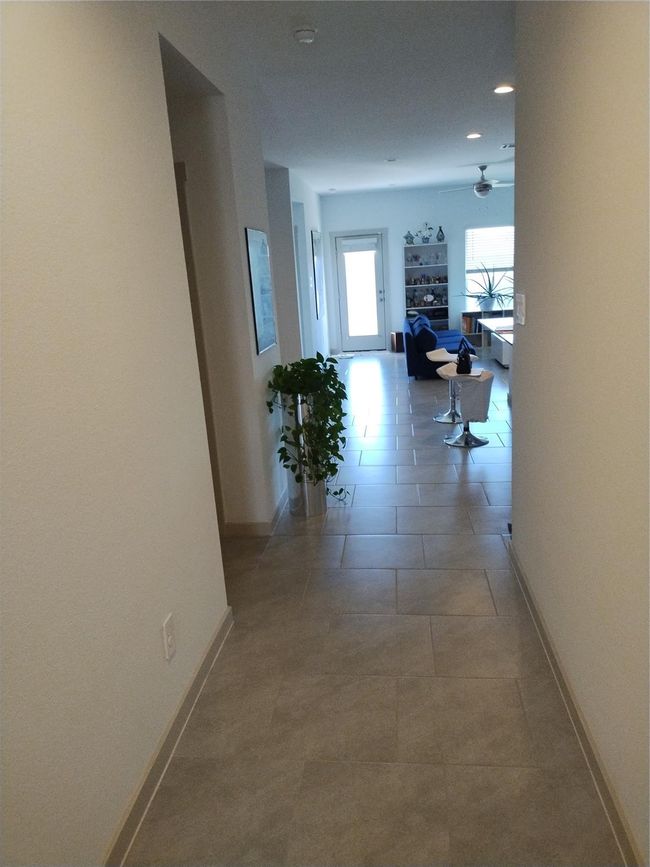 View looking from front door into living area. | Image 18