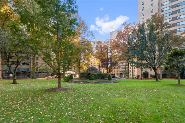View of property's community with a lawn | Image 19