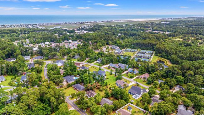 Aerial perspective of suburban area featuring a nearby body of water | Image 33