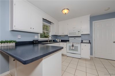 Kitchen, Freshly Painted Cabinets & Trim | Image 3