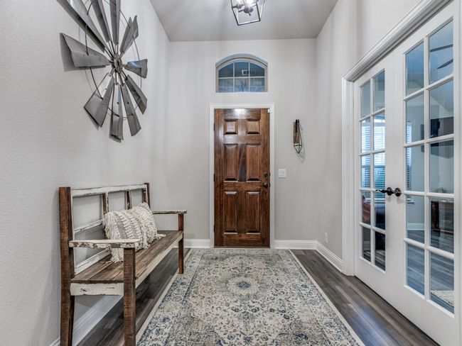 Foyer featuring dark wood-type flooring and french doors | Image 13