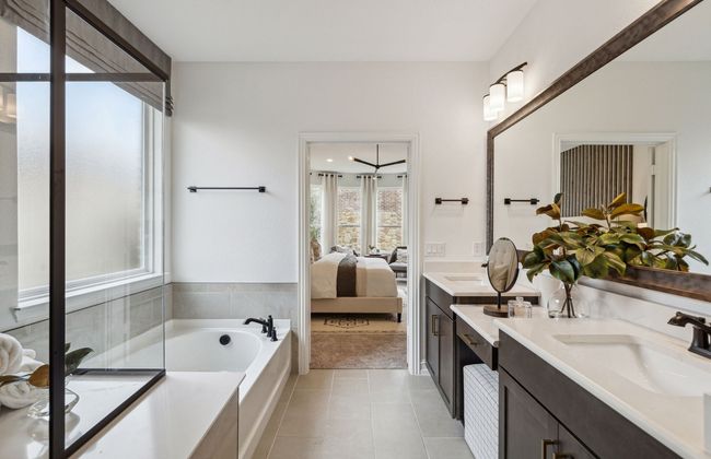 Owner's bath designed with a double vanity and oversized shower *Model representation | Image 15