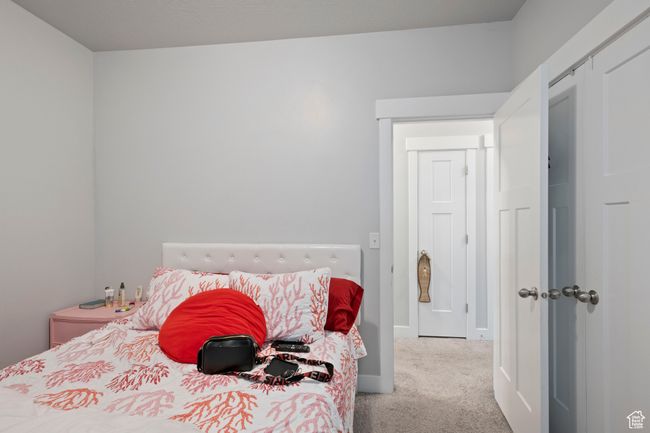 Carpeted bedroom featuring baseboards and a closet | Image 13