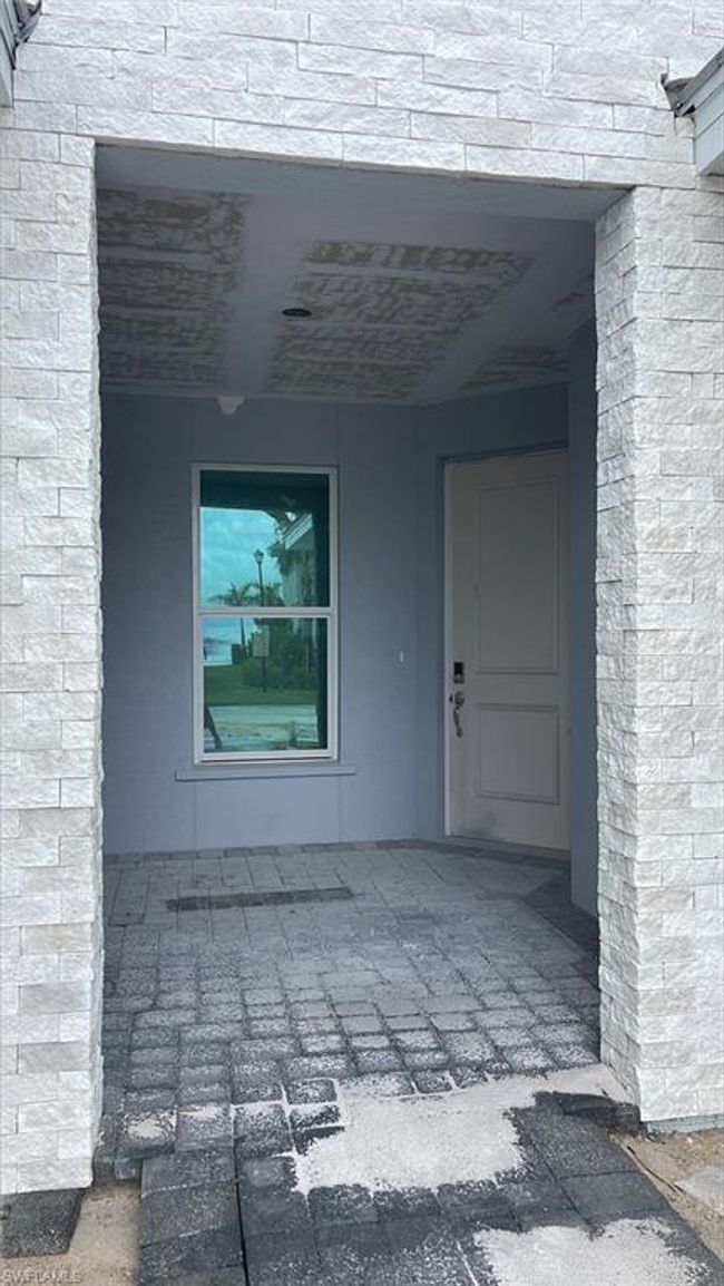 Private front door entrance and covered front patio space | Image 2