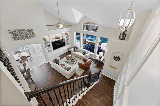 Travel upstairs to the huge gameroom, office nook, and 3 additional bedrooms. | Image 32