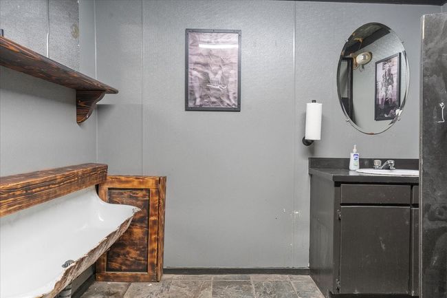 Bathroom featuring vanity and stone finish flooring | Image 16