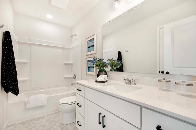 Large quartz countertop in upper level hall bath. | Image 19