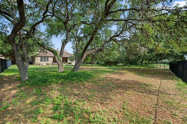 View of yard with fence | Image 33