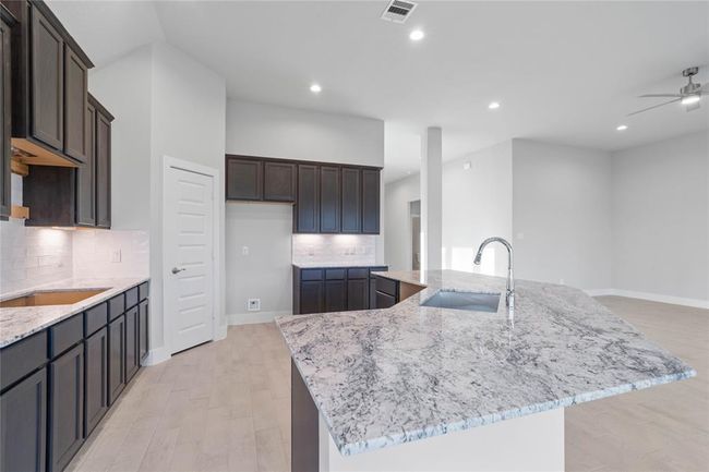 This photo is for illustrative purposes only and is not to be considered an exact replica of the finished home. Rendering does not match the finished product in terms of features, colors, landscaping, etc. Pricing, specifications, square footage and materials are subject to change at any time and without notice. | Image 8