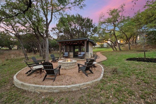 View of yard with an outdoor fire pit | Image 34