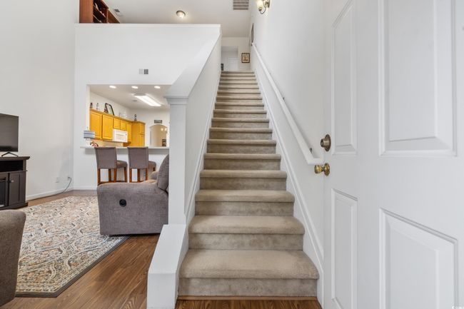 Stairs with wood finished floors and baseboards | Image 24