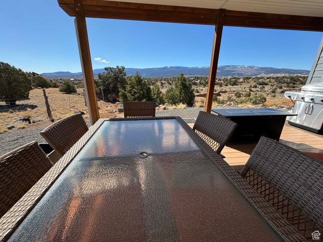 Exterior space with a grill, outdoor dining area, and a mountain view | Image 36