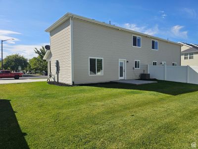 Rear view of house featuring a patio area and a yard | Image 2