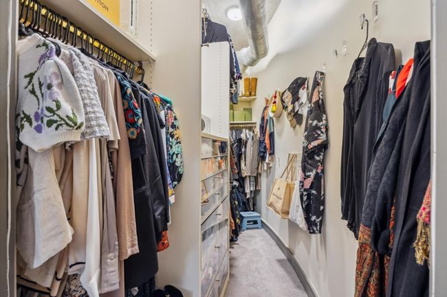 Walkin closet with lot of storage | Image 25