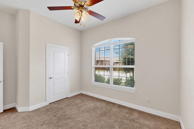 Unfurnished room with carpet and a ceiling fan | Image 17