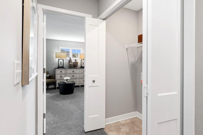 (Photo of a decorated model, actual homes finishes will vary) Centrally located on the upper level, along with the three bedrooms, this laundry room is sure to provide the ultimate convenience. | Image 16