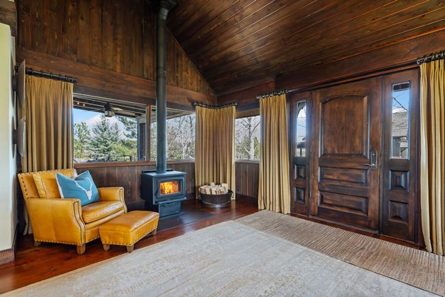 Sitting area at Entrance of home. Featuring recessed lighting, an inviting chandelier, wood finished floors. | Image 12