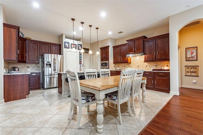 Stunning and spacious kitchen with tile flooring, breakfast area, high ceilings and more! | Image 22