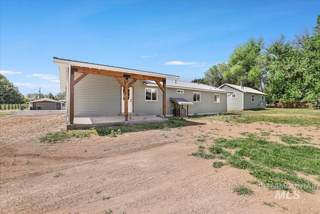 Back of property featuring a metal roof | Image 31