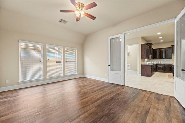 The game room looking towards the kitchen. | Image 21