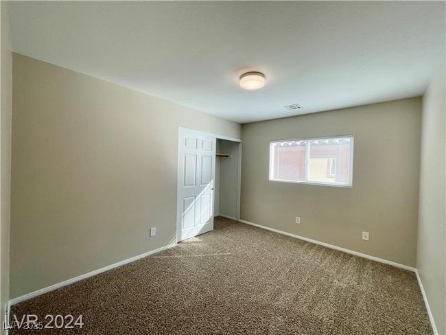 Unfurnished bedroom featuring a closet, baseboards, and carpet floors | Image 14