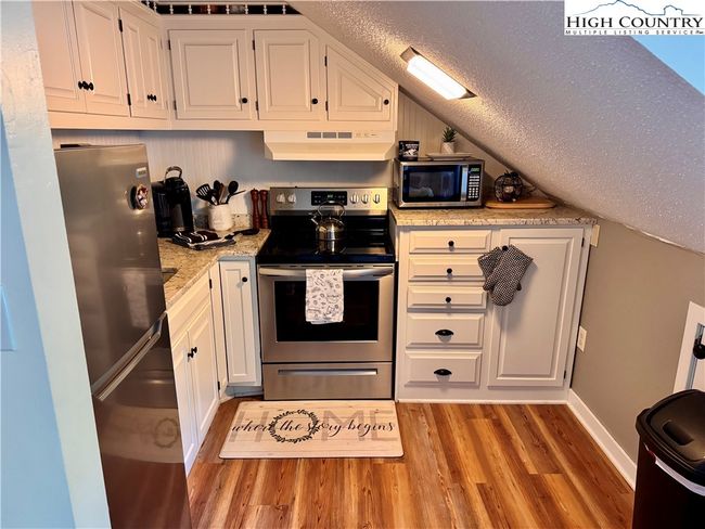 The renovated kitchen has all the fixins' for an evening in. | Image 18