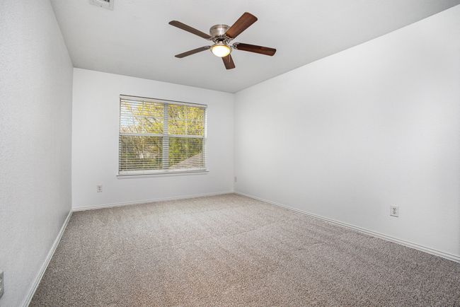 Bedroom featuring baseboards, carpet floors, and a ceiling fan | Image 23