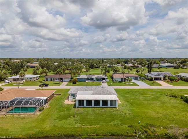 Aerial perspective of suburban area with a pool area | Image 39
