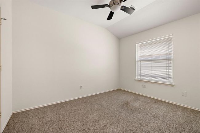 Cozy and functional second bedroom, designed to fit your lifestyle needs. | Image 15