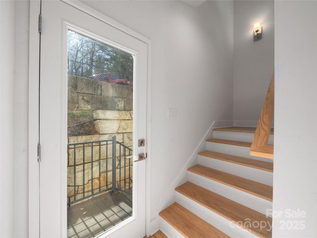 Staircase to the upper level just past the elevator | Image 17