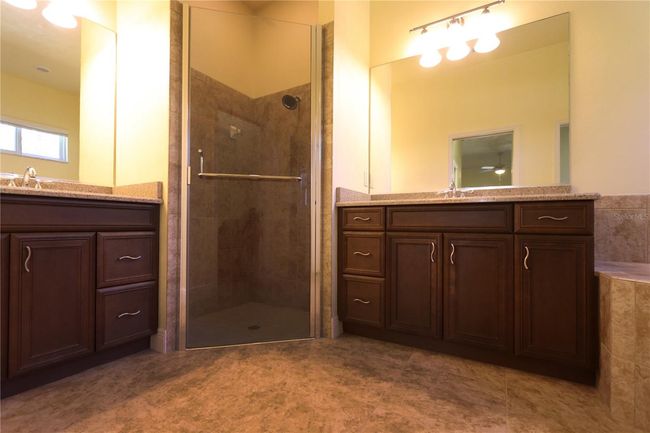 Large shower, wood cabinets in master bath | Image 10