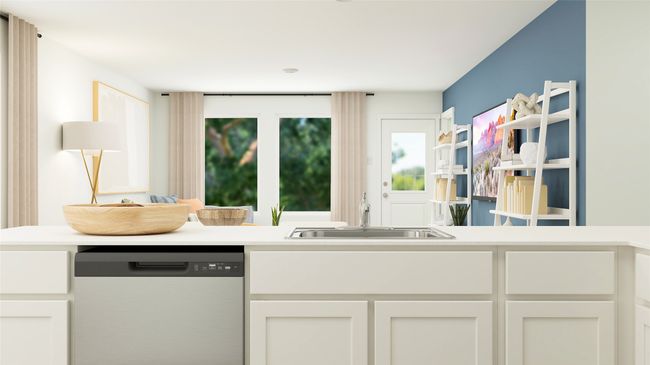 Kitchen featuring dishwashing machine, light countertops, and white cabinetry | Image 4