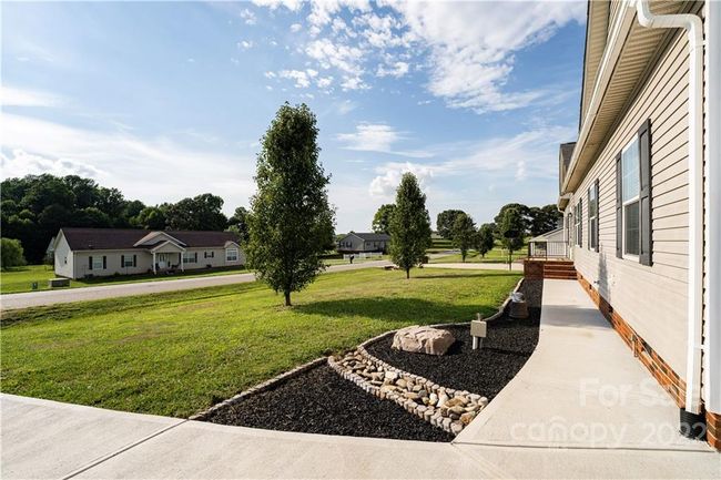 View from top of driveway facing neighborhood entrance | Image 5