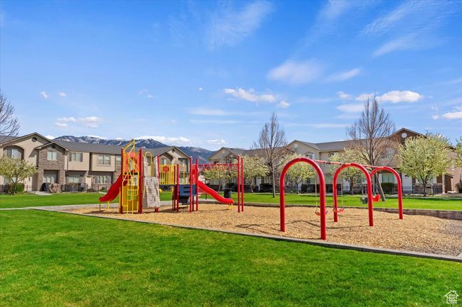 Communal playground with a yard and a mountain view | Image 32