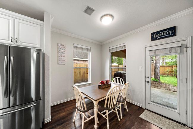 Enjoy the view and natural light of the backyard while eating breakfast. | Image 9